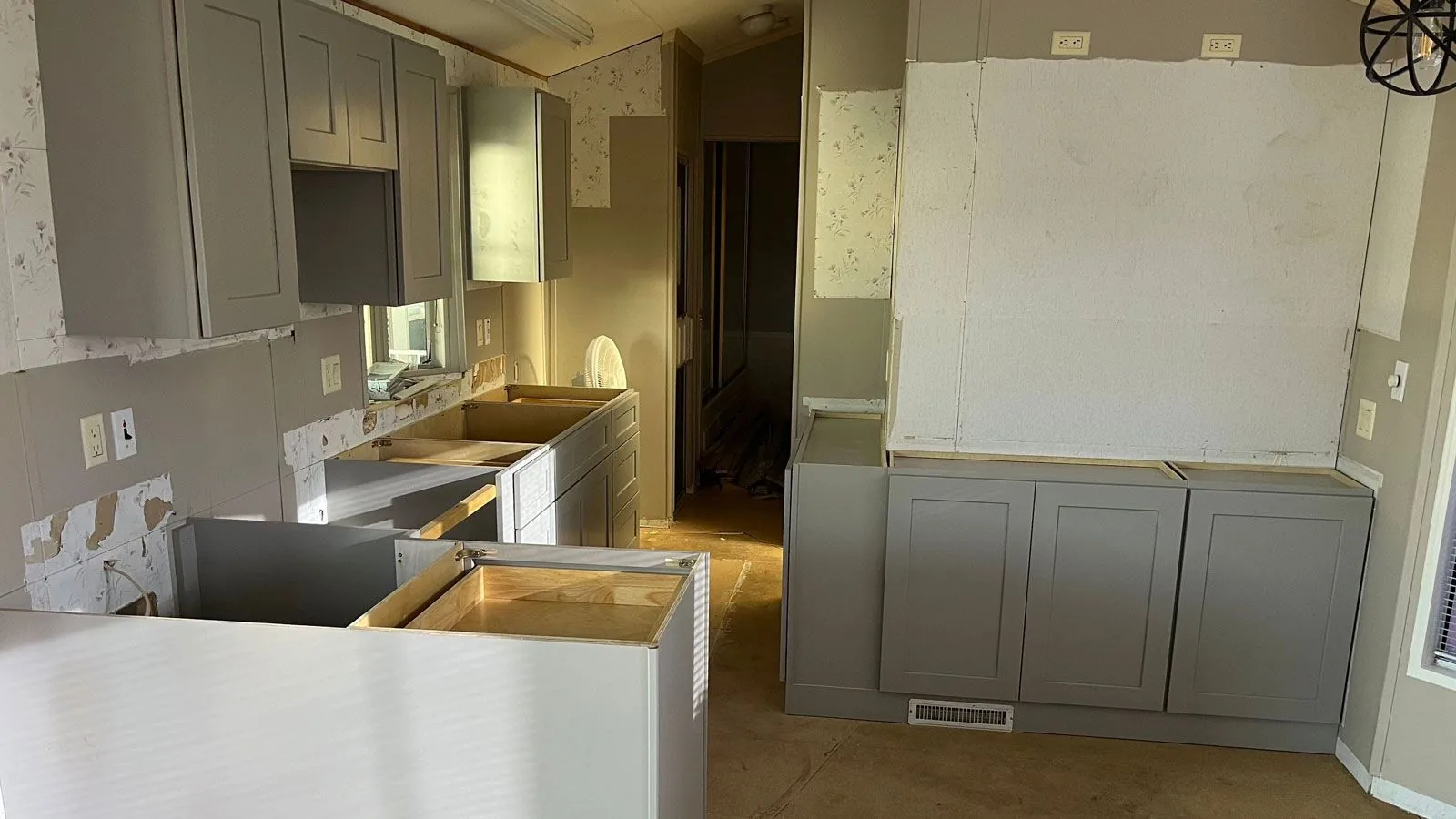 New cabinets installed during a kitchen remodel, before countertops