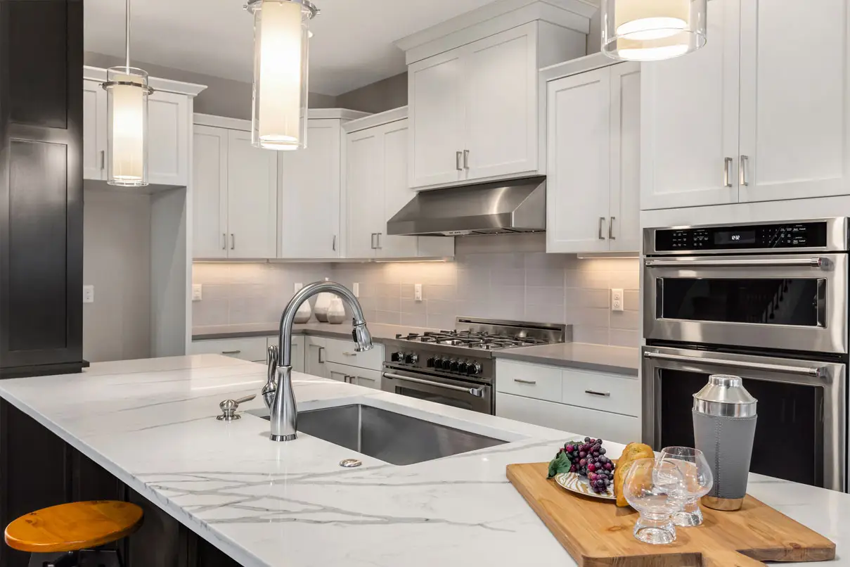 Quartz countertop installed with white kitchen cabinets in a Phoenix home