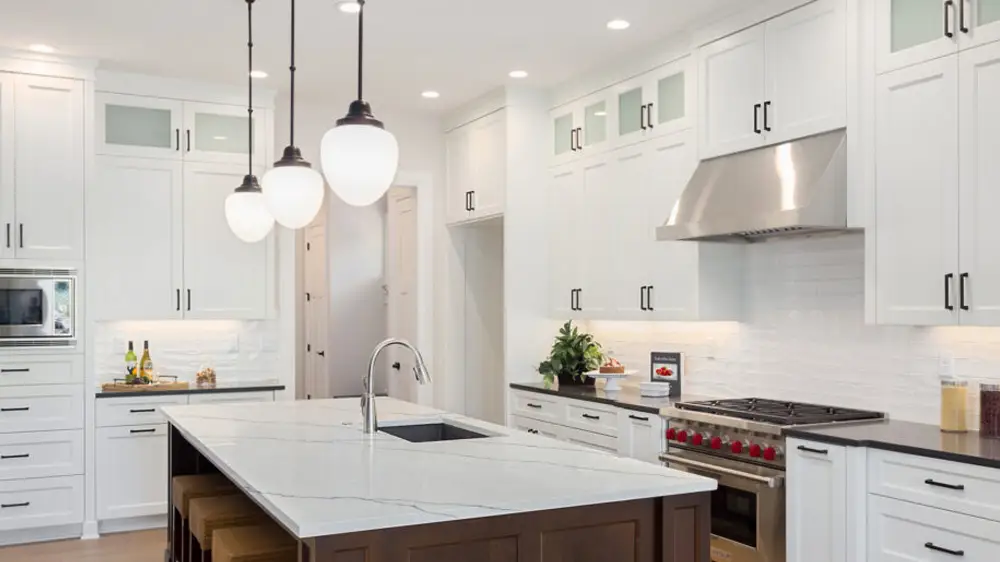 Kitchen with a large quartz island in an open layout