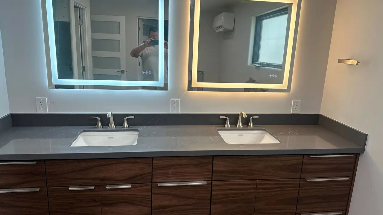 Newly remodeled bathroom with new vanity, countertop and tile installed by Superior Stone & Cabinet in Phoenix