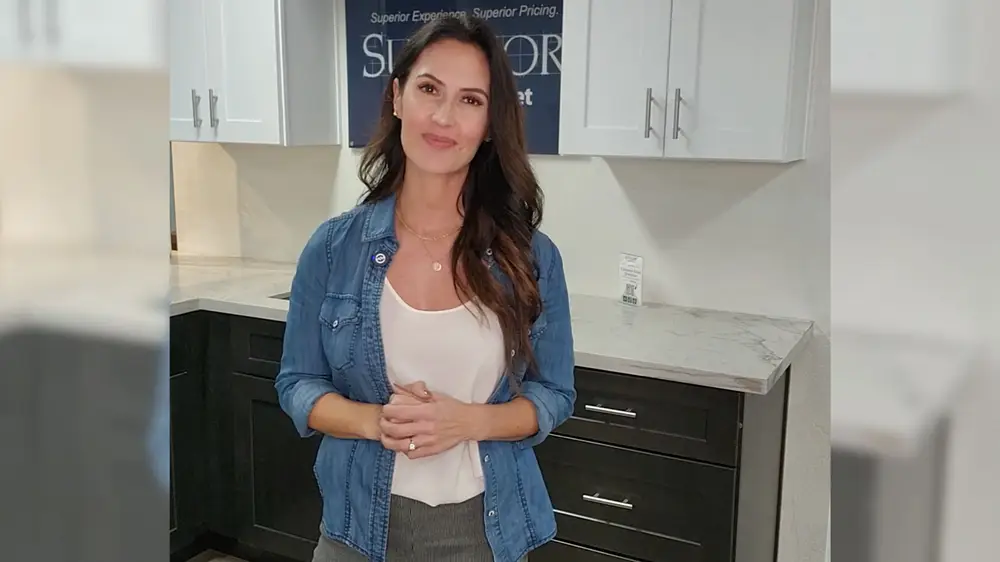 Kelly explains Superior's in-house brand of cabinets.