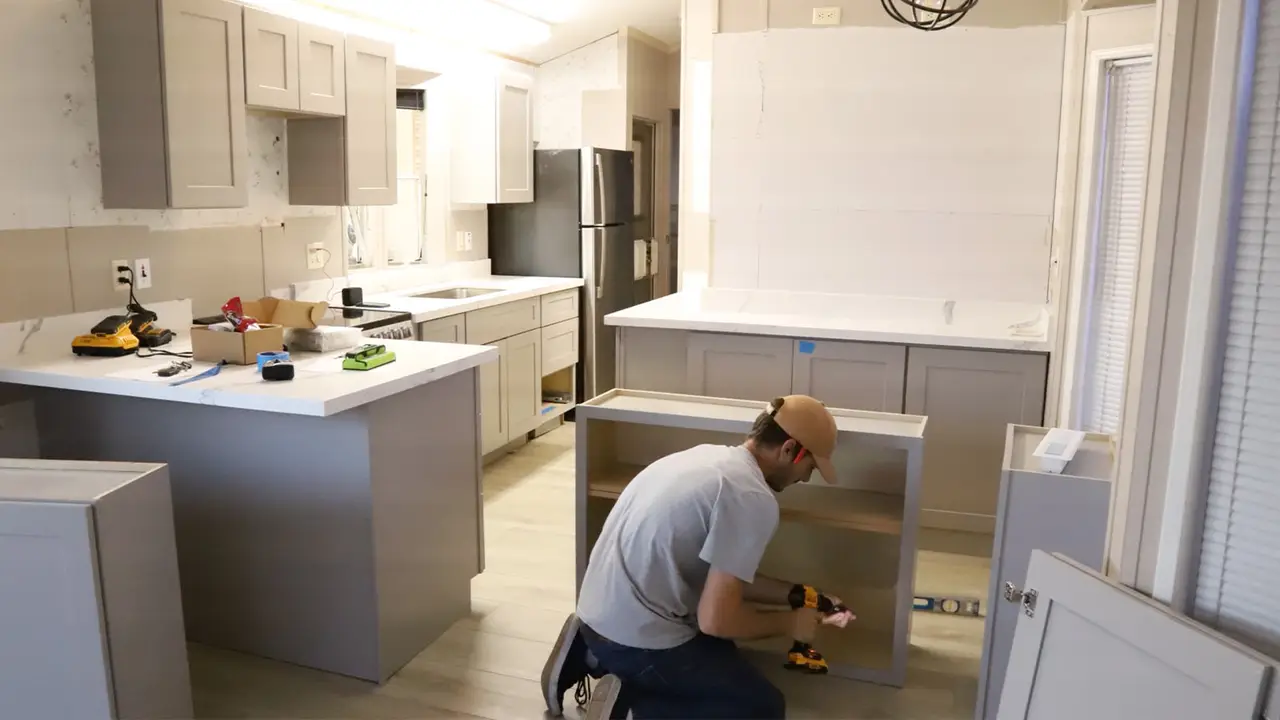 A Superior installer fitting cabinets